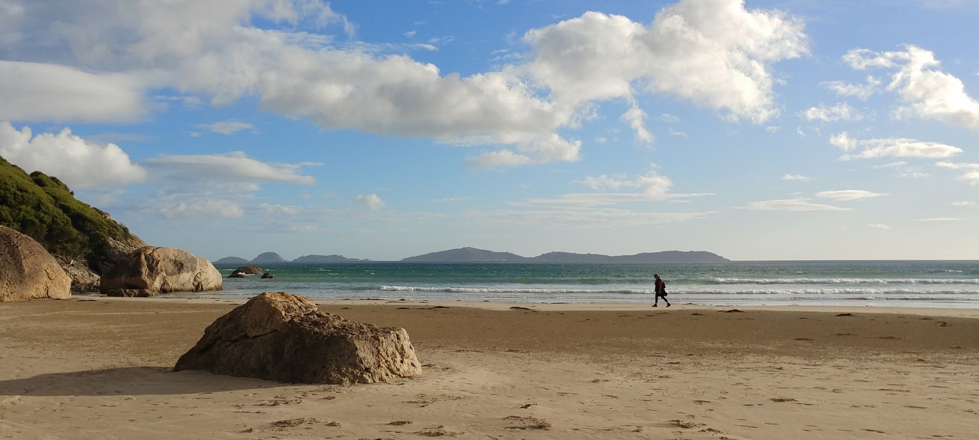 Lyndall walks across Norman Beach at Wilson's Promontory, there is no one else in the picture