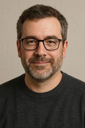 An AI-generated portrait of a middle aged white man with glasses and a short beard.