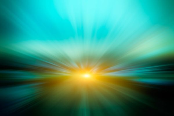 An abstract white light with blue, orange and yellow rays.