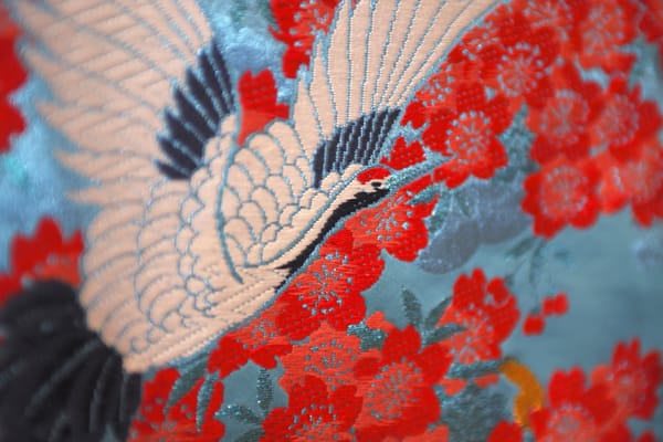 A beautiful crane and red flowers on a piece of Japanese fabric