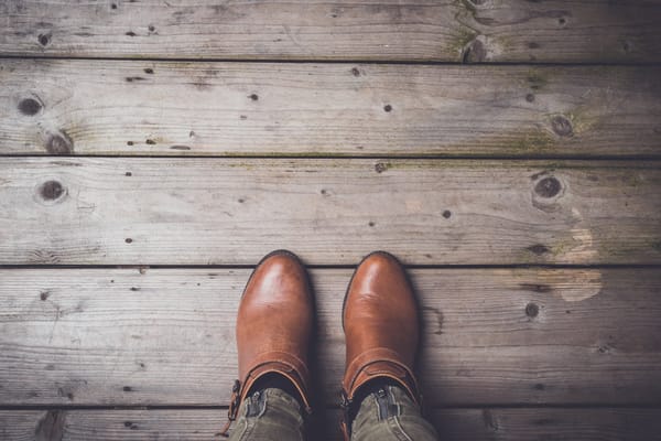 Brown boots on a wooden floor